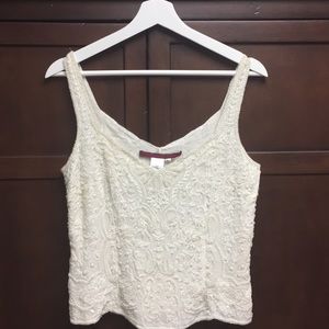 Embellished sleeveless top with side zipper.